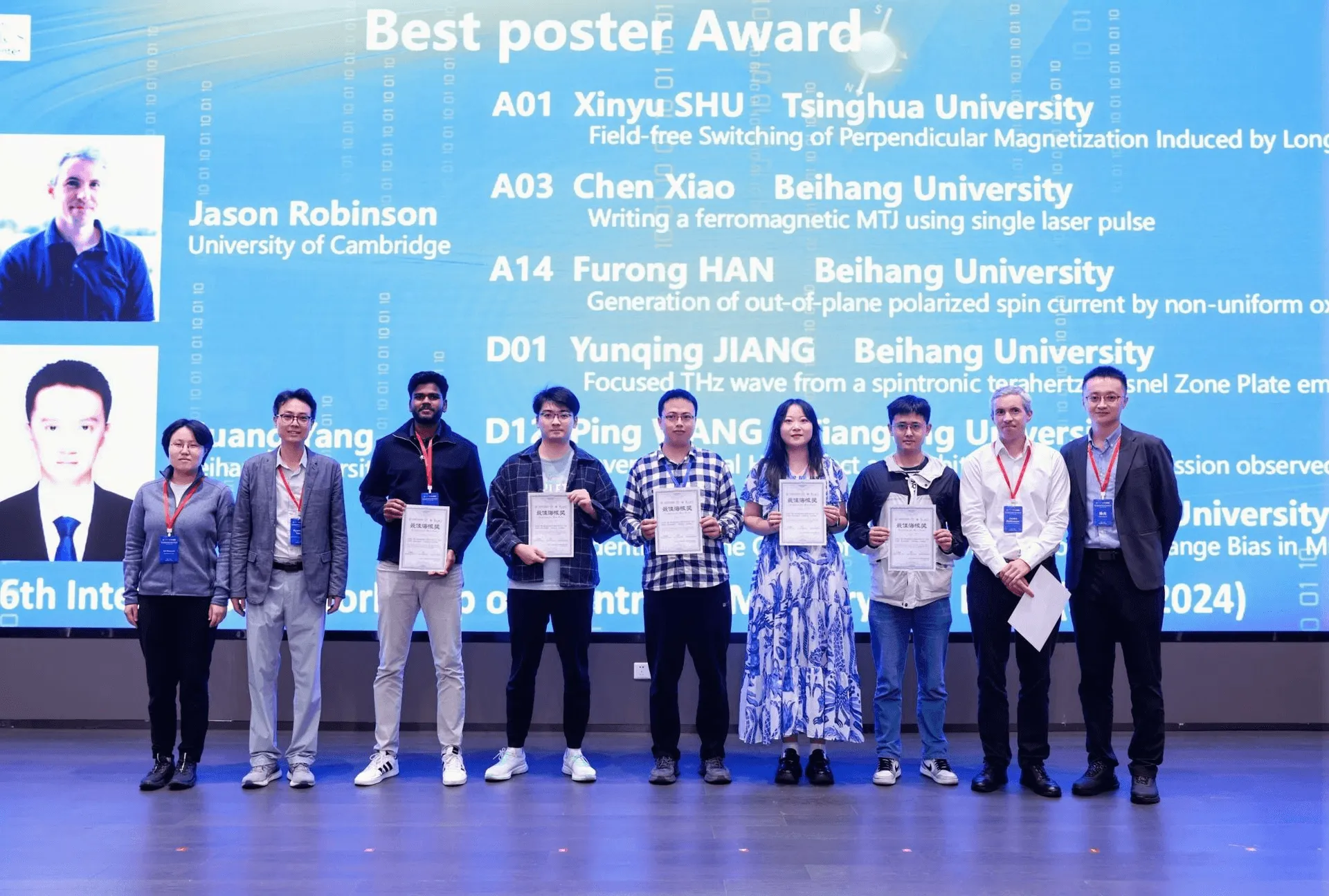 Aditya Kumar and eight other researchers holding best-poster-award certificates on stage at the 2024 Spintronic Memory and Logic workshop in Hangzhou, in front of a screen listing the winning posters.