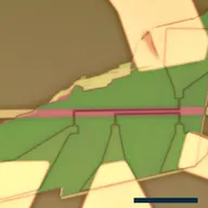 An optical micrograph of the device: a magenta strip running horizontally across a green flake, with pale gold contacts fanning out below it and a dark scale bar at bottom right.